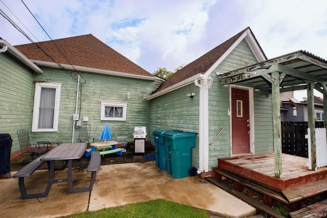403 E Columbia St, Flora, IN 46929 - back of property with a patio area, roof with shingles, and outdoor dining space