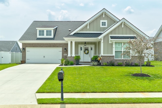 5573 Camden Dr, Newburgh, IN 47630 - craftsman-style house featuring board and batten siding, brick siding, driveway, an attached garage, and roof with shingles