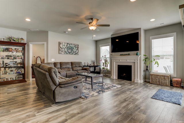 5573 Camden Dr, Newburgh, IN 47630 - living area featuring ceiling fan, wood finished floors, a fireplace, and recessed lighting