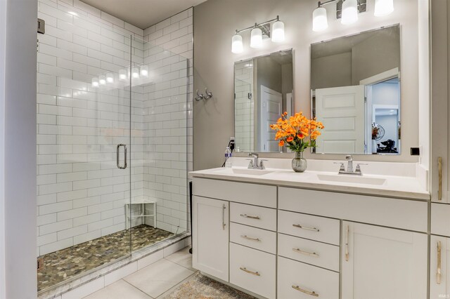 5573 Camden Dr, Newburgh, IN 47630 - bathroom with a shower stall, double vanity, and tile patterned floors