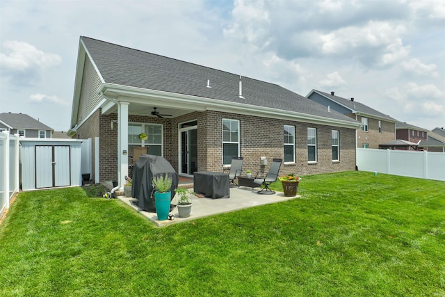 5573 Camden Dr, Newburgh, IN 47630 - back of house featuring a ceiling fan, a patio, brick siding, a fenced backyard, and a shed