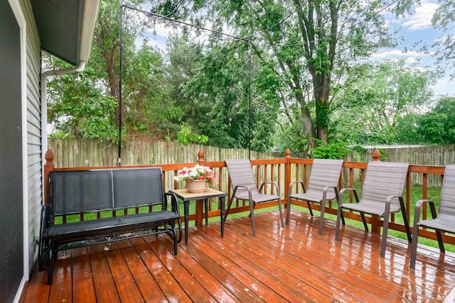 5209 Jenny Ln, Mishawaka, IN 46545 - deck with a fenced backyard and view of scattered trees