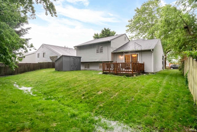 5209 Jenny Ln, Mishawaka, IN 46545 - back of property with a deck, a shed, a fenced backyard, and roof with shingles