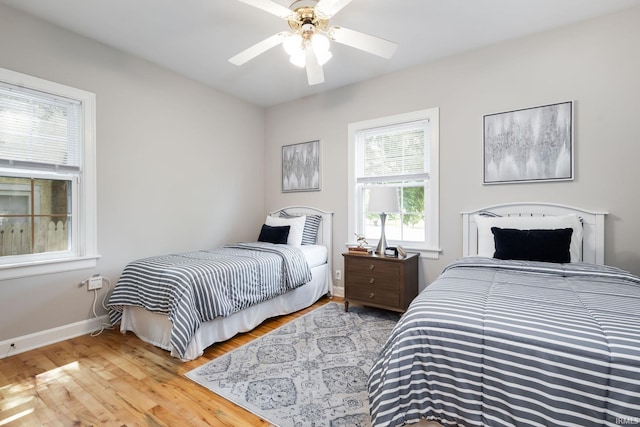 415 Wakewa Ave, South Bend, IN 46617 - bedroom with light wood-type flooring and a ceiling fan