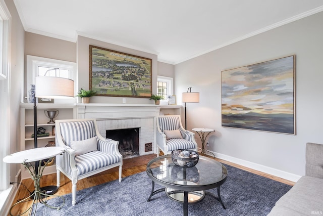 415 Wakewa Ave, South Bend, IN 46617 - living room featuring wood finished floors, crown molding, and a brick fireplace