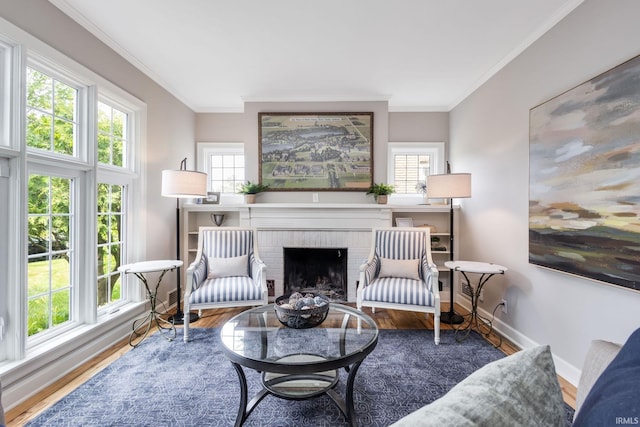 415 Wakewa Ave, South Bend, IN 46617 - living area featuring crown molding, wood finished floors, and a brick fireplace