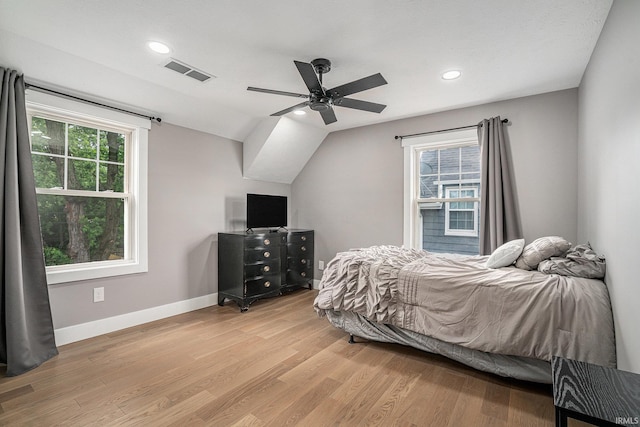 1414 Longfellow Ave, South Bend, IN 46615 - bedroom featuring light wood-type flooring, multiple windows, recessed lighting, vaulted ceiling, and a ceiling fan