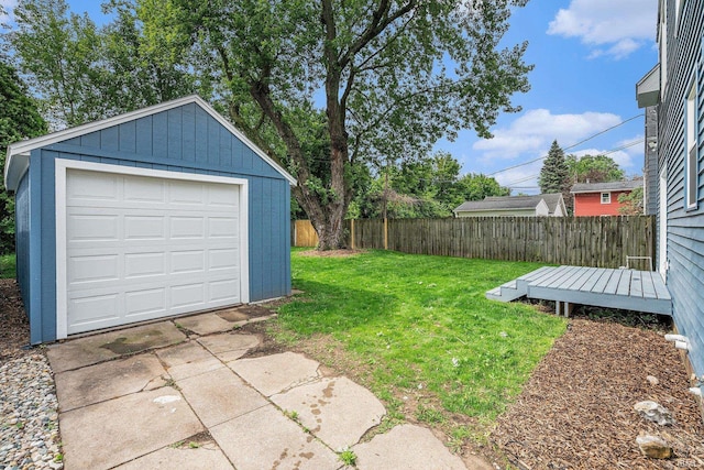 1414 Longfellow Ave, South Bend, IN 46615 - fenced backyard with an outdoor structure, a garage, and driveway