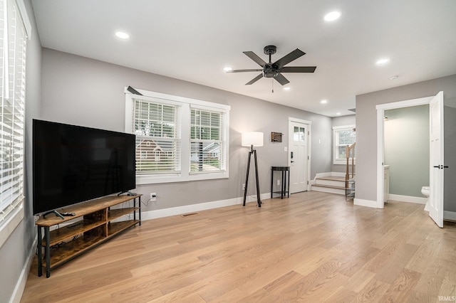 1414 Longfellow Ave, South Bend, IN 46615 - living room featuring ceiling fan, recessed lighting, light wood finished floors, and stairway