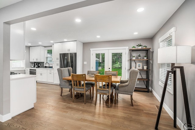 1414 Longfellow Ave, South Bend, IN 46615 - dining space featuring french doors, light wood-style flooring, healthy amount of natural light, and recessed lighting