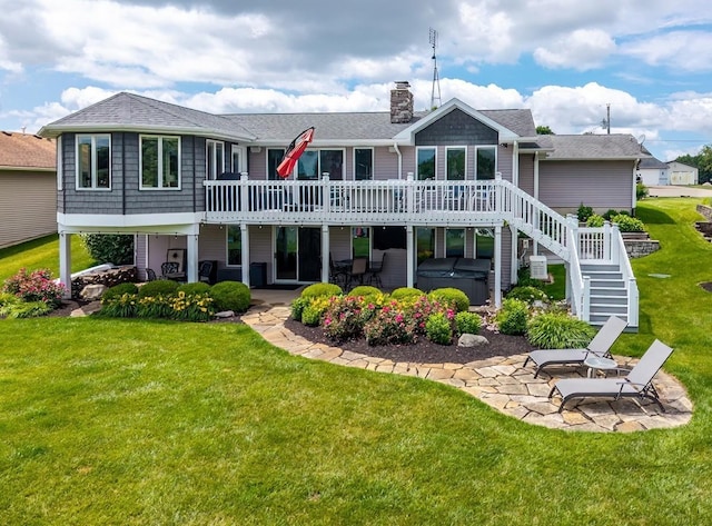 280 Ln 230 Jimmerson Lk, Angola, IN 46703 - rear view of house with a hot tub, a patio, a wooden deck, a chimney, and a shingled roof