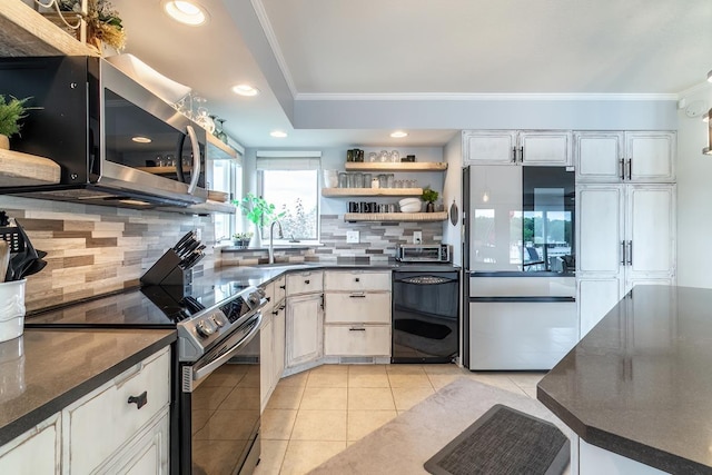 280 Ln 230 Jimmerson Lk, Angola, IN 46703 - kitchen featuring stainless steel appliances, crown molding, backsplash, light tile patterned flooring, and recessed lighting