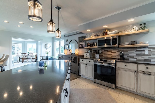 280 Ln 230 Jimmerson Lk, Angola, IN 46703 - kitchen with appliances with stainless steel finishes, open shelves, dark countertops, decorative backsplash, and crown molding