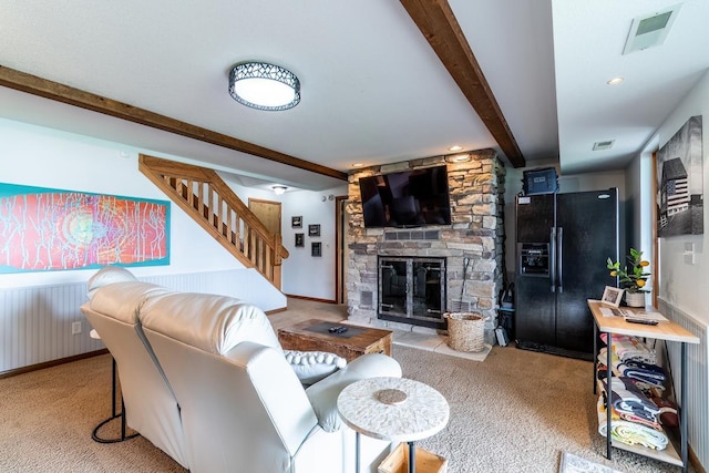 280 Ln 230 Jimmerson Lk, Angola, IN 46703 - carpeted living area featuring beam ceiling, stairs, and a fireplace