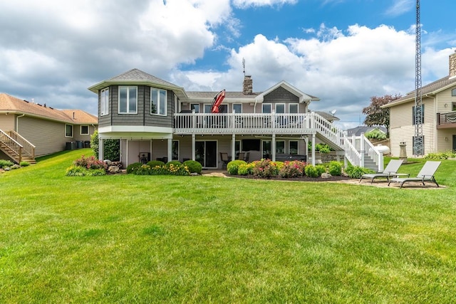 280 Ln 230 Jimmerson Lk, Angola, IN 46703 - back of property with stairway, a deck, a chimney, and a lawn