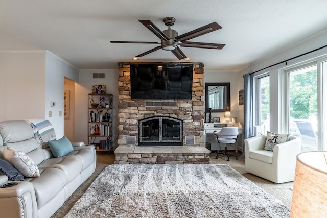 280 Ln 230 Jimmerson Lk, Angola, IN 46703 - living area featuring carpet, ornamental molding, a stone fireplace, and a ceiling fan