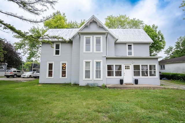 120 N Main St, Avilla, IN 46710 - back of house featuring a lawn and a metal roof