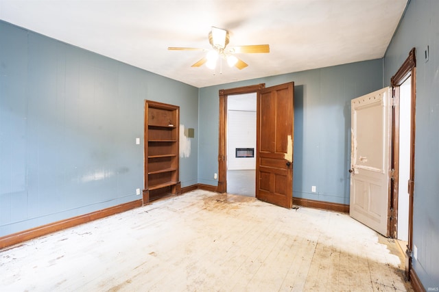 120 N Main St, Avilla, IN 46710 - unfurnished bedroom with a ceiling fan and light wood-style flooring