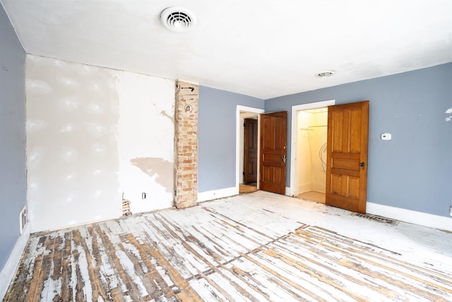 120 N Main St, Avilla, IN 46710 - unfurnished bedroom featuring wood finished floors and baseboards