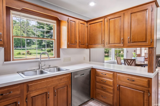 1406 W Orchard Dr, North Manchester, IN 46962 - kitchen with dishwasher, light countertops, brown cabinetry, plenty of natural light, and recessed lighting