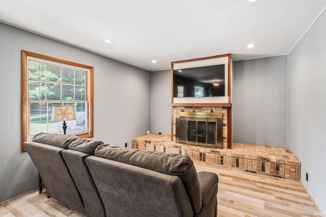 1406 W Orchard Dr, North Manchester, IN 46962 - living room with wood finished floors, a brick fireplace, and recessed lighting