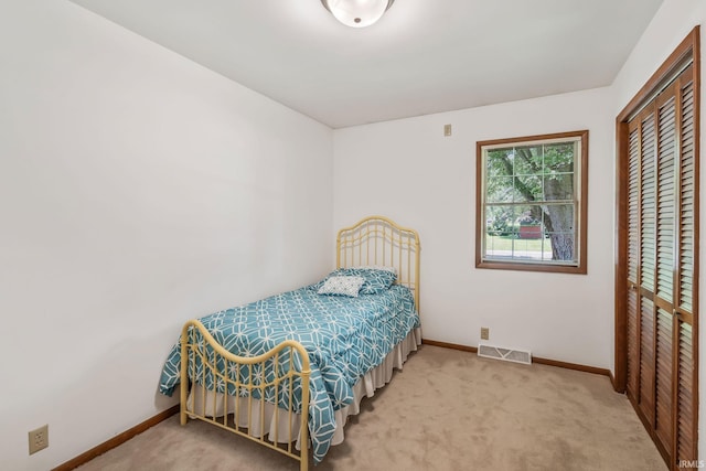 1406 W Orchard Dr, North Manchester, IN 46962 - carpeted bedroom featuring baseboards and a closet