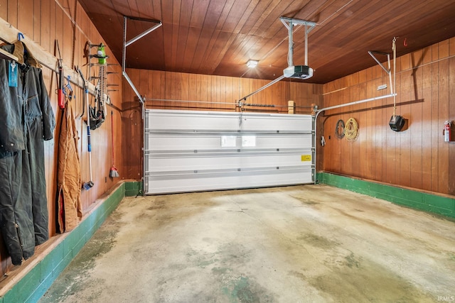 1406 W Orchard Dr, North Manchester, IN 46962 - garage featuring wooden walls, a garage door opener, and wood ceiling