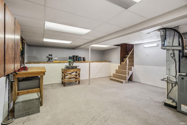 1406 W Orchard Dr, North Manchester, IN 46962 - finished below grade area with a paneled ceiling, stairway, concrete block wall, and a workshop area