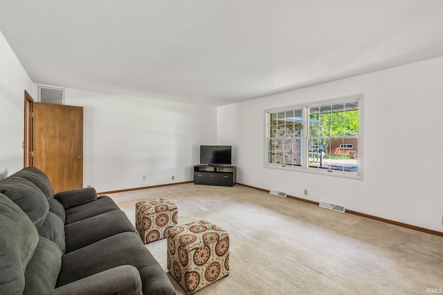 1406 W Orchard Dr, North Manchester, IN 46962 - living area featuring light carpet and baseboards