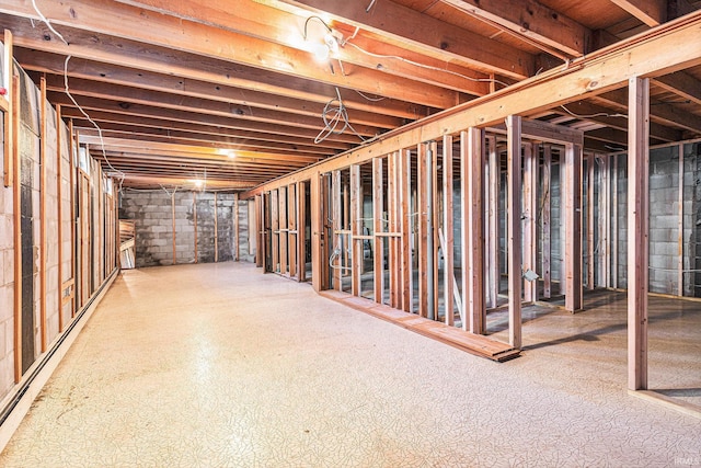 60220 Robin Hood Ln, Elkhart, IN 46517 - unfinished basement featuring a baseboard radiator