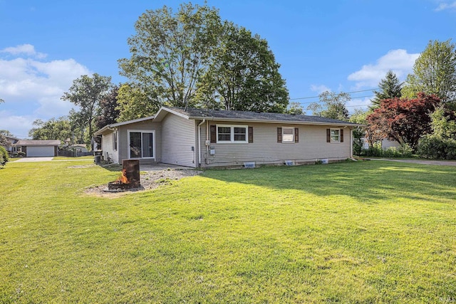 60220 Robin Hood Ln, Elkhart, IN 46517 - view of front of home featuring a front yard and a fire pit