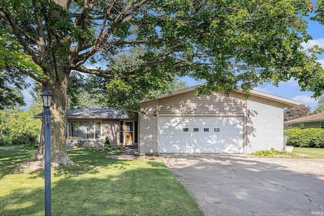 60220 Robin Hood Ln, Elkhart, IN 46517 - view of front of property featuring brick siding, asphalt driveway, and a front lawn