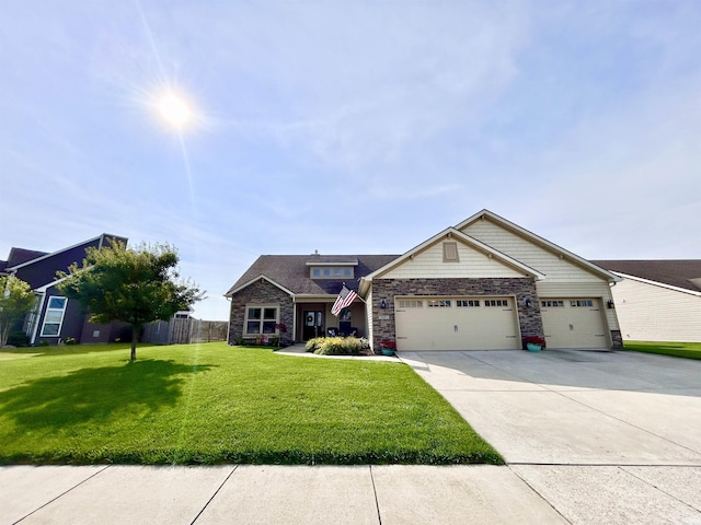 3607 Regatta Dr, Lafayette, IN 47909 - view of front facade featuring stone siding, a garage, and concrete driveway