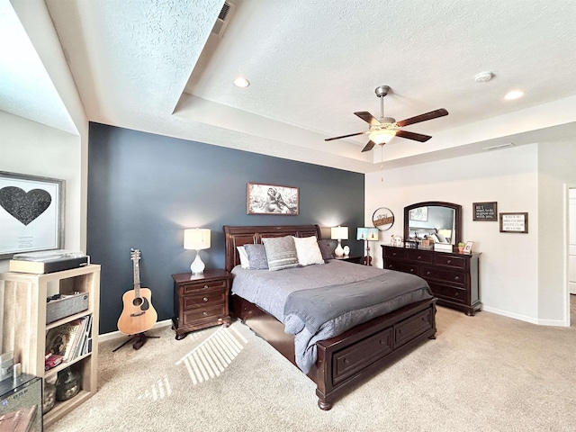3607 Regatta Dr, Lafayette, IN 47909 - bedroom with light carpet, a textured ceiling, a tray ceiling, recessed lighting, and a ceiling fan