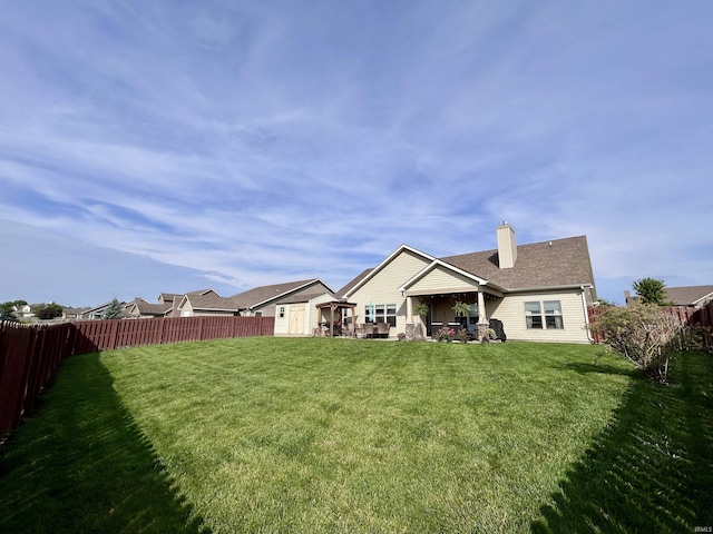 3607 Regatta Dr, Lafayette, IN 47909 - back of property with a chimney and a fenced backyard