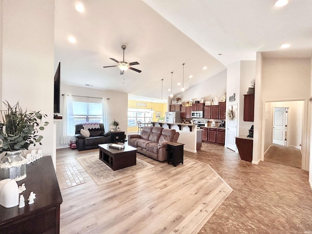 3607 Regatta Dr, Lafayette, IN 47909 - living room with high vaulted ceiling, a ceiling fan, recessed lighting, and light wood-type flooring