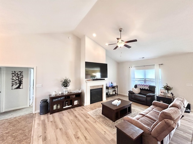 3607 Regatta Dr, Lafayette, IN 47909 - living area featuring ceiling fan, high vaulted ceiling, a tile fireplace, and light wood-style floors