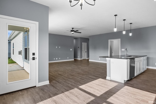 323 Haddington Ln, Lafayette, IN 47905 - kitchen with dark countertops, dark wood finished floors, decorative light fixtures, and white cabinets