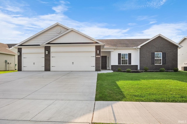 323 Haddington Ln, Lafayette, IN 47905 - ranch-style home with brick siding, an attached garage, concrete driveway, and a front lawn