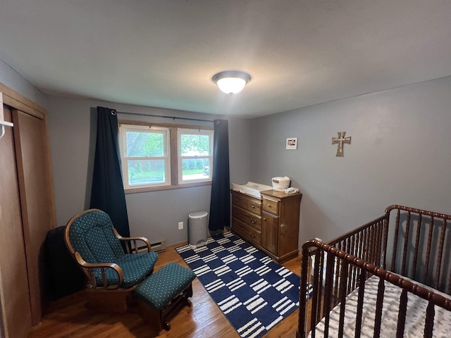 406 Twillo Run Dr, New Haven, IN 46774 - bedroom featuring wood finished floors and baseboard heating