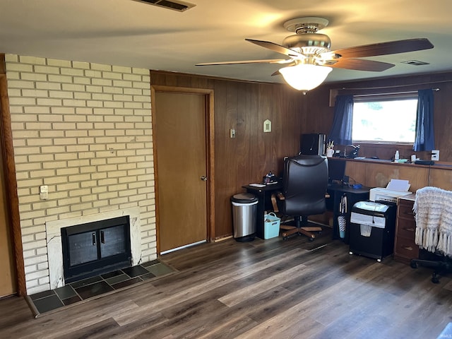 406 Twillo Run Dr, New Haven, IN 46774 - home office with ceiling fan, wood finished floors, wood walls, and a brick fireplace