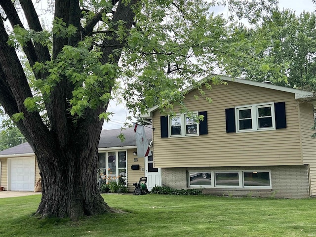 406 Twillo Run Dr, New Haven, IN 46774 - split level home featuring a front yard and brick siding