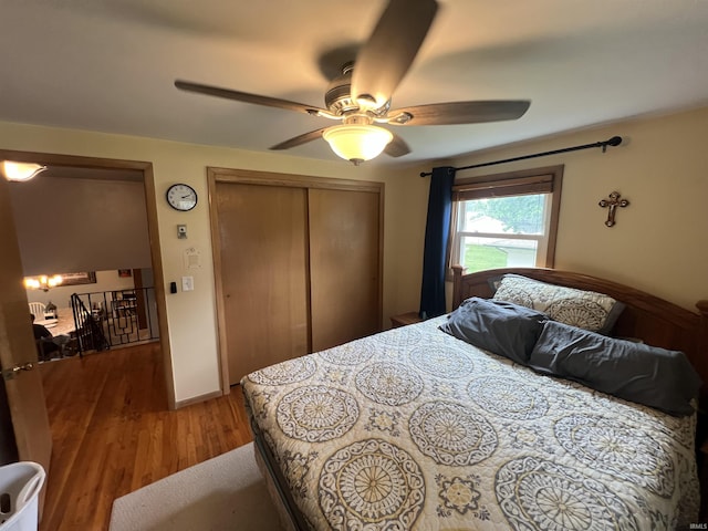 406 Twillo Run Dr, New Haven, IN 46774 - bedroom with wood finished floors, a closet, and a ceiling fan