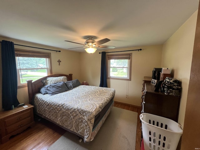 406 Twillo Run Dr, New Haven, IN 46774 - bedroom with wood finished floors, multiple windows, and ceiling fan