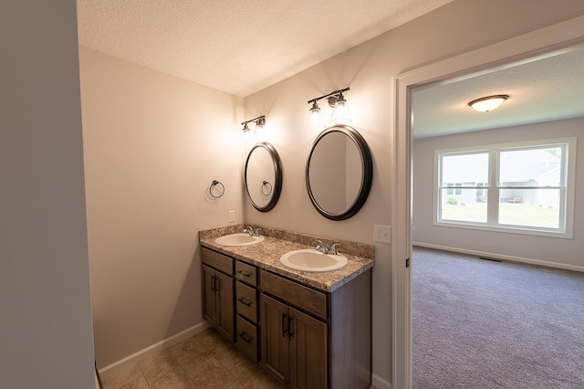 5205 Pigeon Creek Ct, Fort Wayne, IN 46825 - bathroom with double vanity and a textured ceiling
