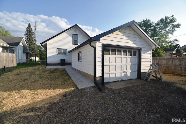 606 E Green St, Frankfort, IN 46041 - view of home's exterior featuring an outdoor structure and an attached garage