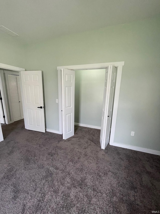 312 E 2nd St, Bicknell, IN 47512 - unfurnished bedroom featuring dark carpet and a closet