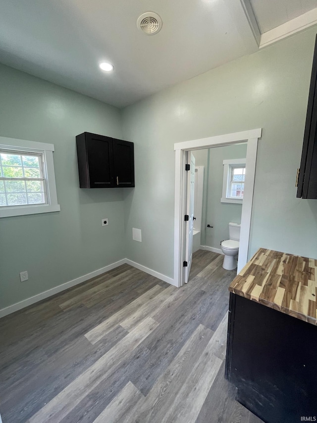312 E 2nd St, Bicknell, IN 47512 - laundry room featuring wood finished floors, plenty of natural light, and hookup for an electric dryer