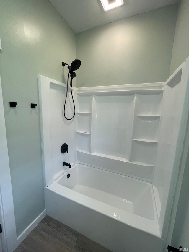 312 E 2nd St, Bicknell, IN 47512 - full bath featuring wood finished floors and  shower combination