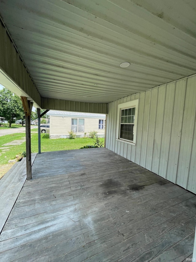 312 E 2nd St, Bicknell, IN 47512 - wooden terrace featuring a lawn and a carport